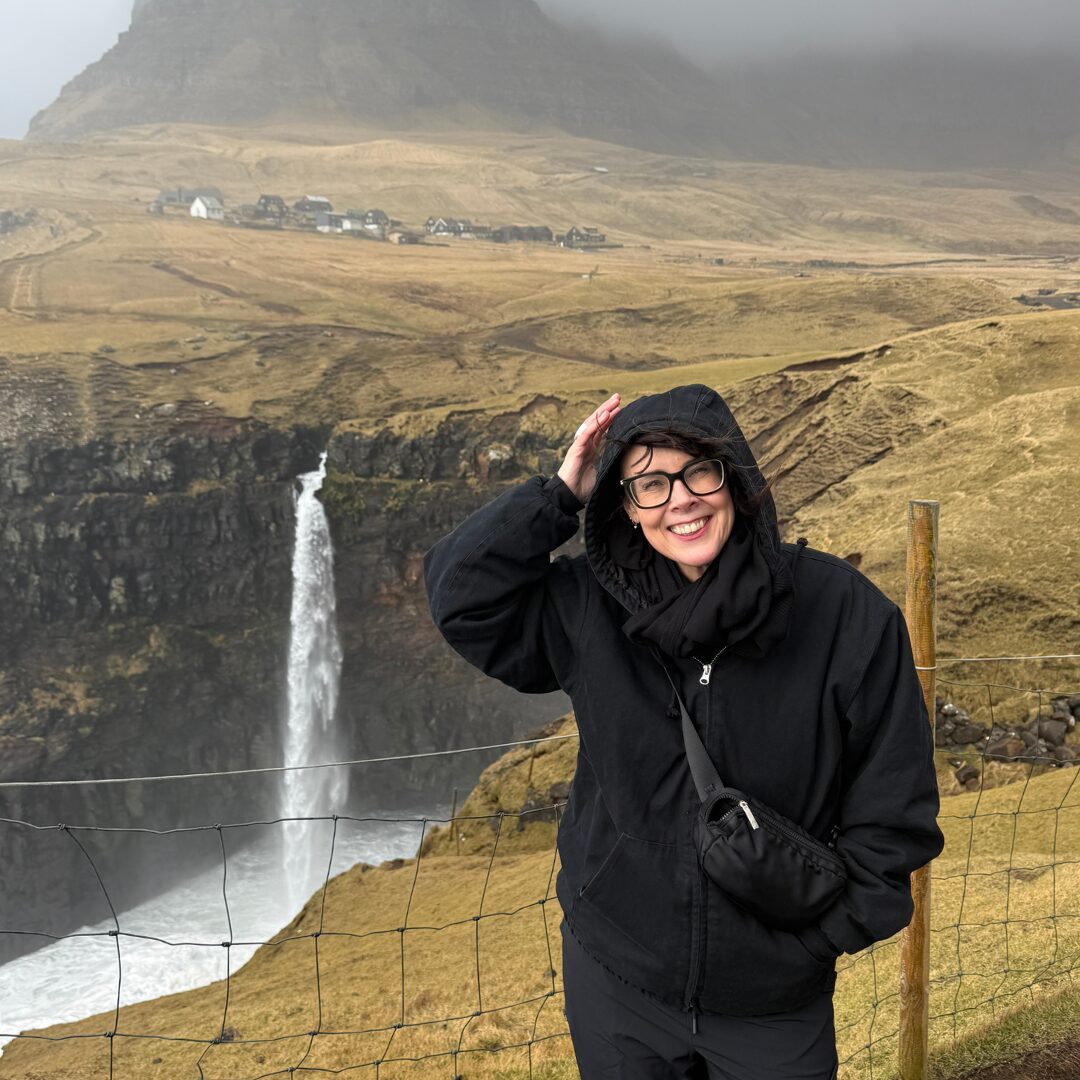 Standing in front of Múlafossur Waterfall