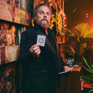 corporate magician delivers close-up magic for a business event