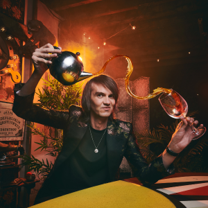 corporate magician performing close-up magic for a business event